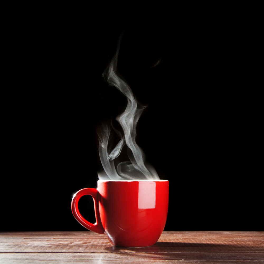 a steaming cup of coffee